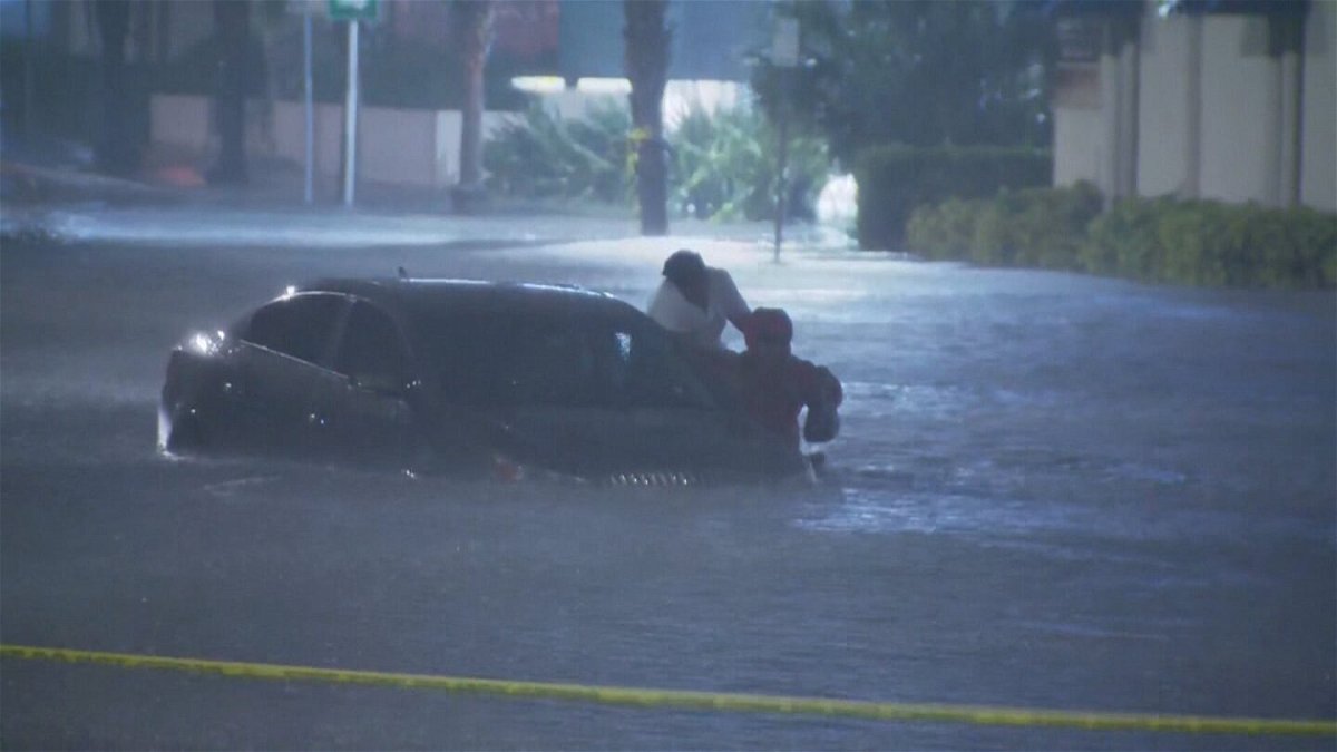 <i>WESH</i><br/>WESH reporter Tony Atkins rescues woman from her car that was stuck in flood waters from Hurricane Ian.