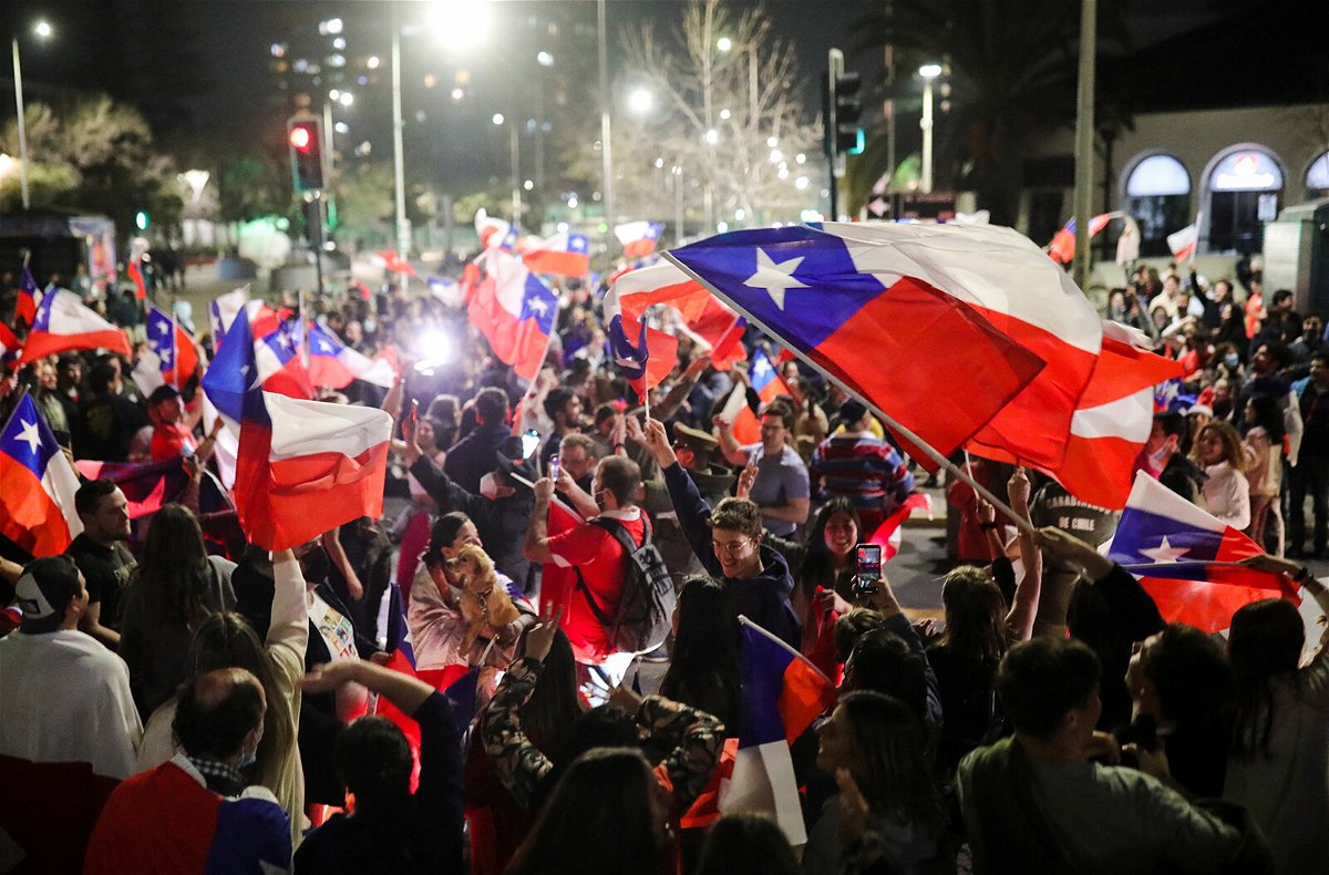 <i>Pablo Sanhueza/Reuters</i><br/>Some waved flags as they celebrated the rejection of the proposed constitution in Santiago