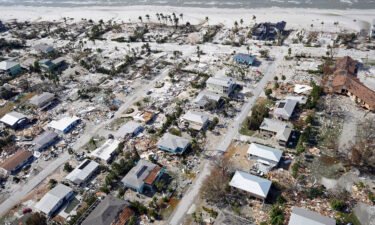 This aerial photo shows damaged homes and debris in the aftermath of Hurricane Ian on September 29 in Fort Myers
