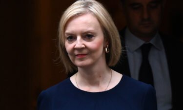 Britain's Prime Minister Liz Truss walks out of Number 10 Downing Street in London on September 23. US officials are increasingly troubled by  Truss's proposal to slash taxes during inflation.