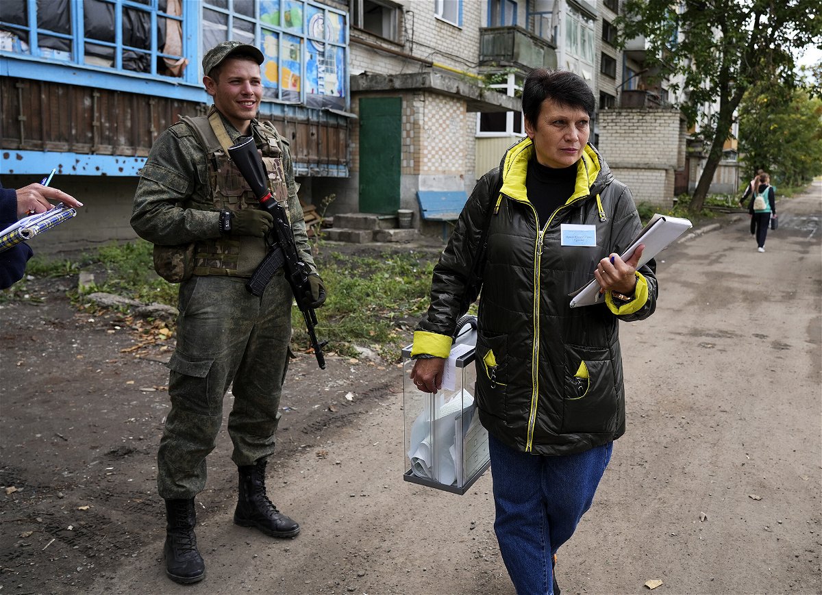 <i>Anadolu Agency/Getty Images</i><br/>People cast their votes in controversial referendums in Donetsk Oblast