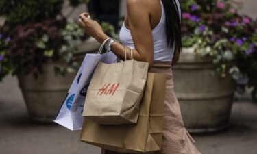 A shopper carries an H&M bag in New York