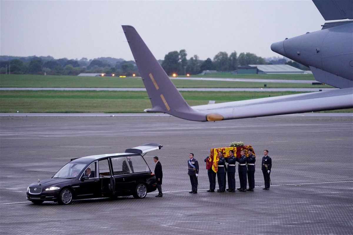 <i>Andrew Matthews/Pool/AFP/Getty Images</i><br/>Pallbearers from the Queen's Colour Squadron (63 Squadron RAF Regiment) leave having carried the coffin of Queen Elizabeth II to the Royal Hearse having removed it from the C-17 at the Royal Air Force Northolt airbase on September 13.