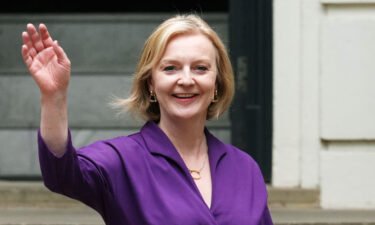 New Conservative Party leader and incoming prime minister Liz Truss waves as she leaves Conservative Party Headquarters on September 5 in London. The Conservative Party have elected Truss as their new leader replacing Boris Johnson.