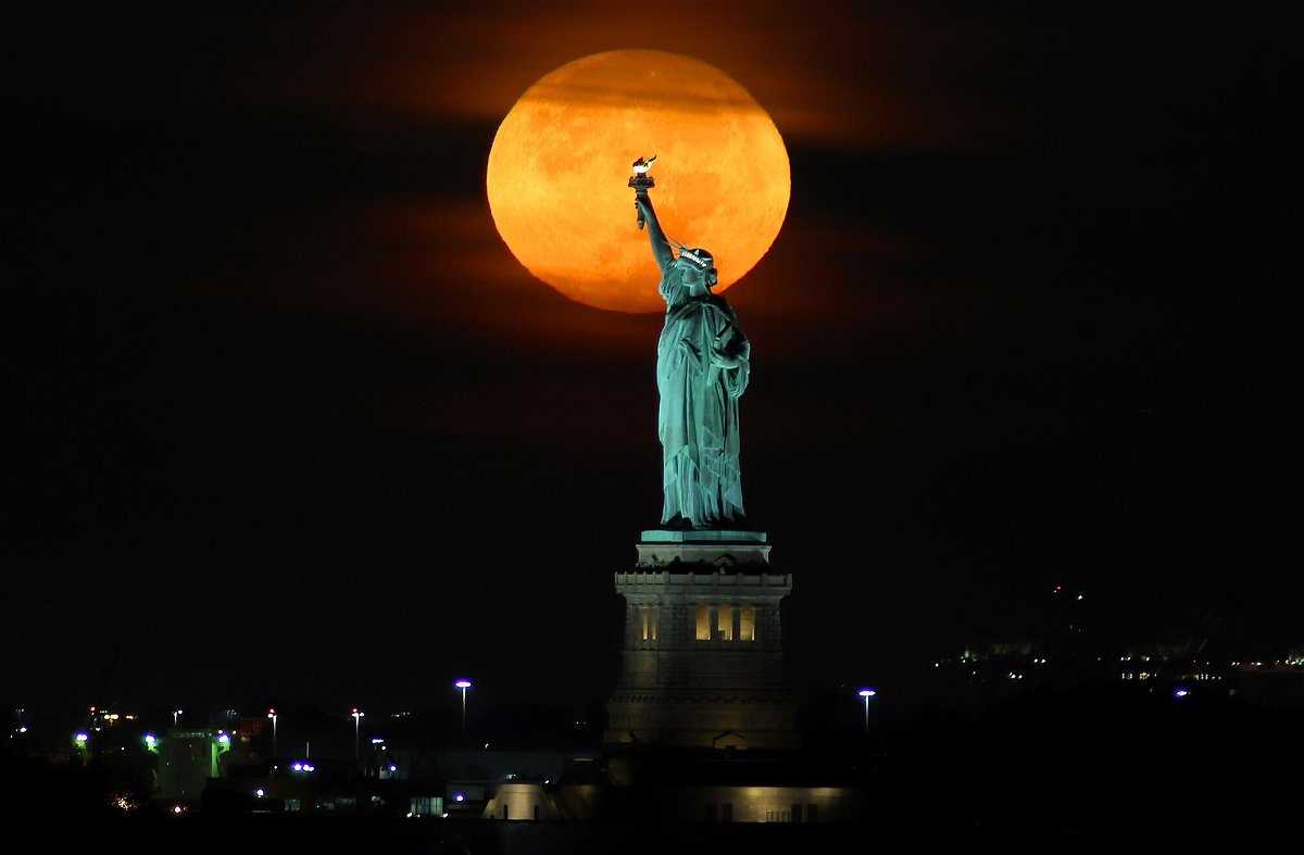 <i>Gary Hershorn/Corbis News/Getty Images</i><br/>September's harvest moon will appear a deep orange color as it ascends into the sky.