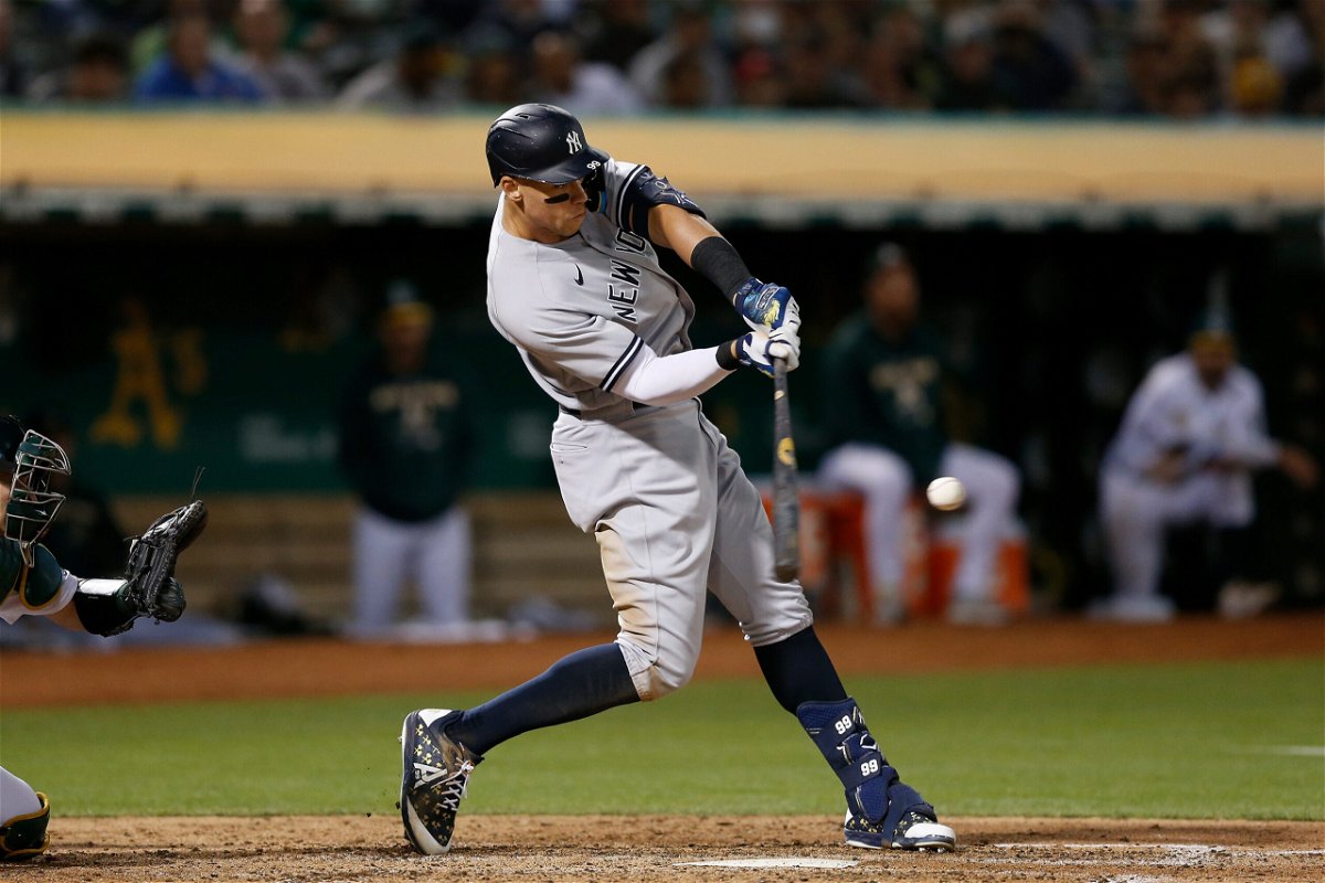 <i>Lachlan Cunningham/Getty Images</i><br/>Aaron Judge of the New York Yankees hits a three-run home run against the Oakland Athletics on August 26 in Oakland