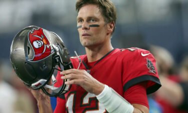 Tom Brady remarked on his latest podcast appearance that he is "close to the end" of his NFL career as he continued to hint at his retirement. Brady is pictured here preparing to take the field for the Bucs against the Cowboys.