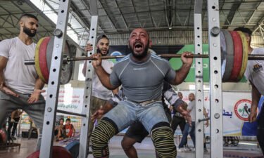 A Palestinian takes part in a weightlifting championship in the southern Gaza Strip town of Khan Yunis on September 24.