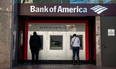 Bank of America is offering zero down payment mortgages for first-time homebuyers in certain Black and Hispanic neighborhoods in a new program. People use ATMs outside a Bank of America branch in San Francisco in 2021.