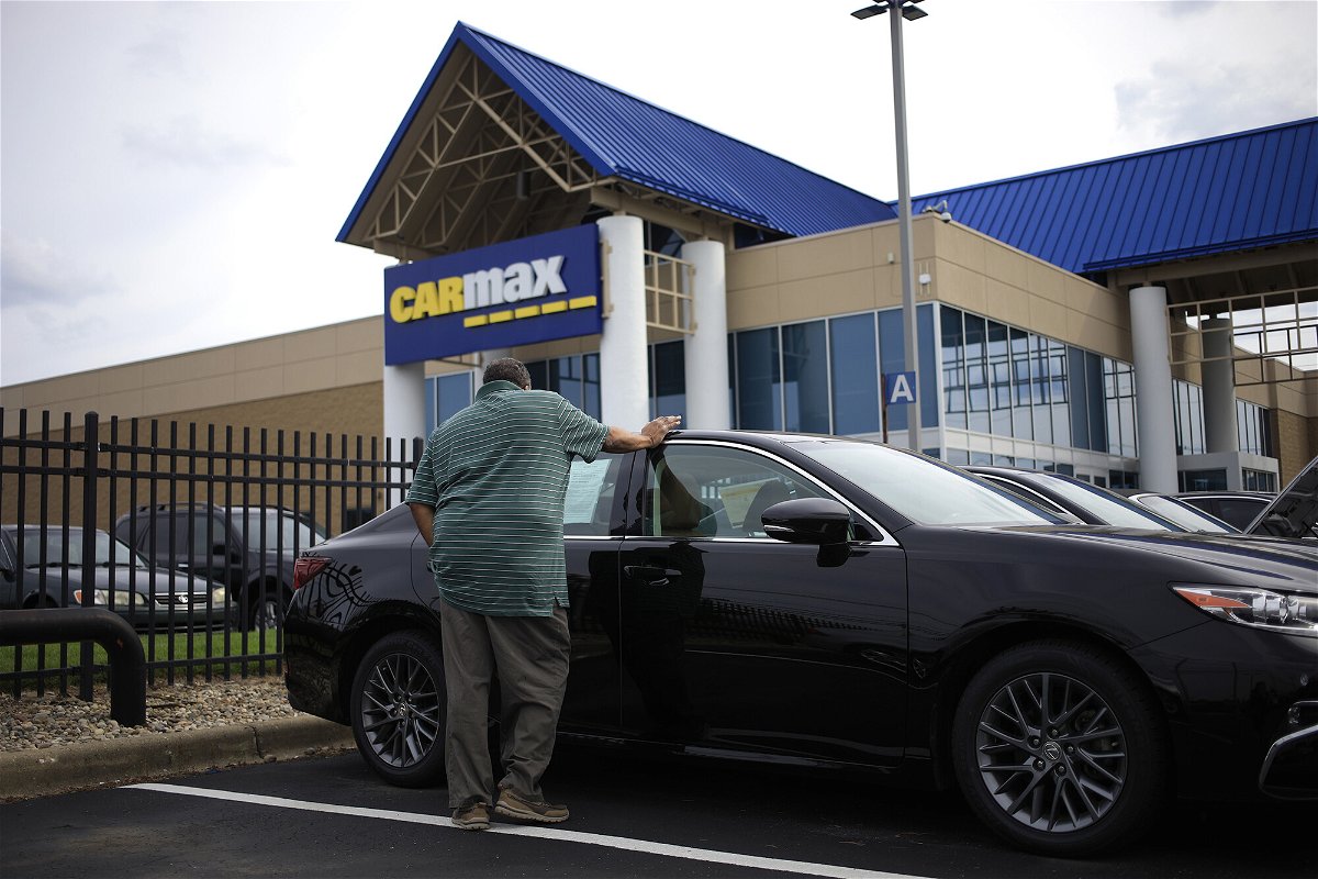<i>Luke Sharrett/Bloomberg/Getty Images</i><br/>High prices and rising interest rates are putting used cars out of reach for a growing number of car shoppers. A customer is seen here shopping for a used vehicle at a CarMax dealership in Louisville