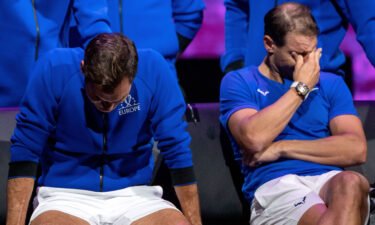 Roger Federer (left) and Nadal watch a video montage after their doubles match at the Laver Cup.