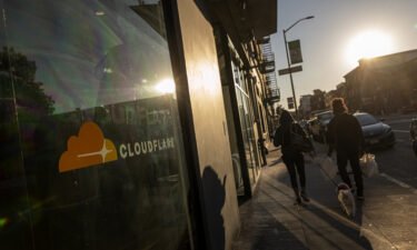 Pedestrians outside the Cloudflare headquarters in San Francisco