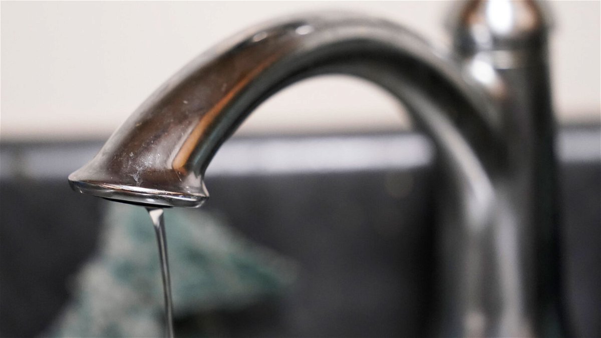 <i>Steve Helber/AP</i><br/>A trickle of water comes out of a faucet at a senior living apartment in Jackson on September 1.
