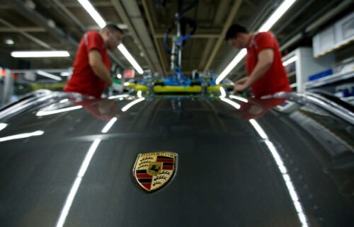 Employees of German car manufacturer Porsche are seen here at the Porsche factory in Stuttgart-Zuffenhausen