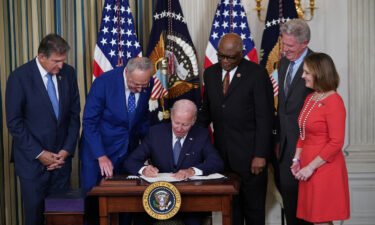 How a simple philosophy helped lead to a White House celebration. US President Joe Biden is pictured here signing the Inflation Reduction Act of 2022 into law during a ceremony at the White House in Washington