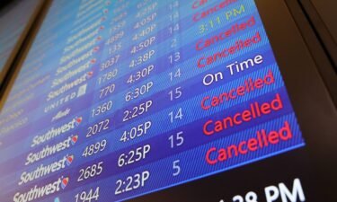 The arrival and departure board lists numerous flight cancellations at Tampa International Airport before its scheduled 5 p.m. closure on September 27.