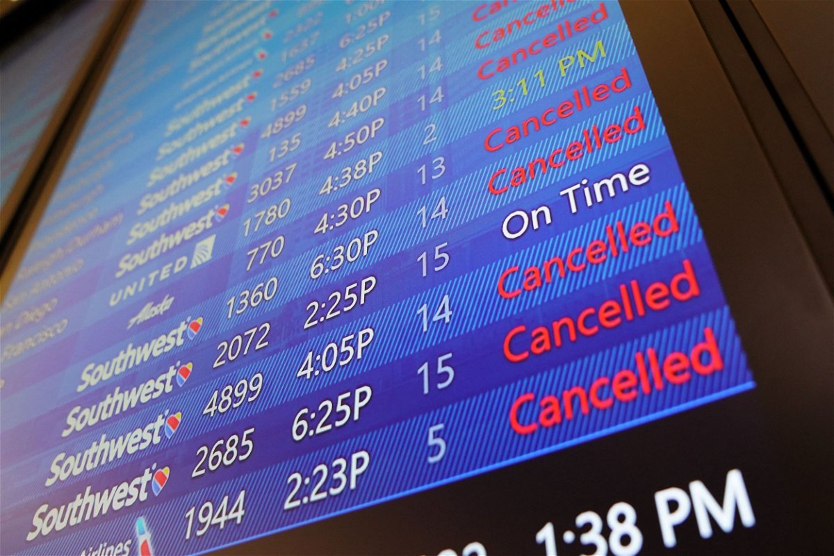 <i>Bryan R. Smith/AFP/Getty Images</i><br/>The arrival and departure board lists numerous flight cancellations at Tampa International Airport before its scheduled 5 p.m. closure on September 27.