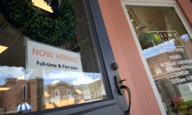 Small business sentiment improved in August but remains depressed as business owners face an uncertain economic landscape. A Now Hiring sign is seen here at the entrance of a small retail business in the Lake Sumter Landing Market Square district.