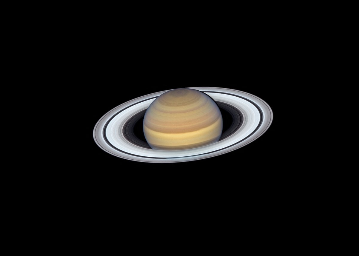 <i>NASA</i><br/>With its striking rings and tilted axis