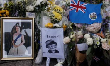 Mourners placed colonial flags and images of the Queen outside the British consulate in Hong Kong on September 12.