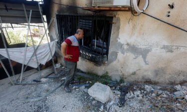 A Palestinian man checks for damage after an Israeli raid in Jenin on September 28.