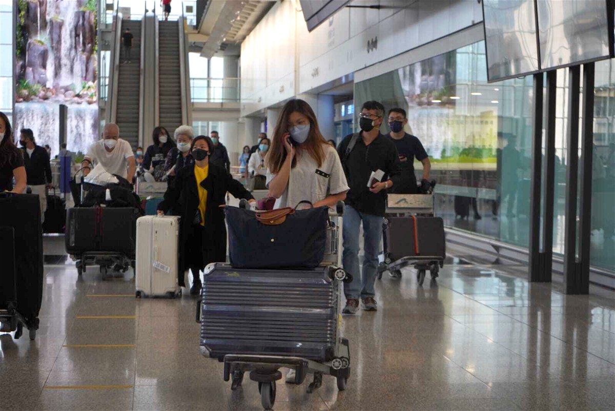 <i>Jan Camenzind Broomby/CNN</i><br/>Passengers are seen here arriving at Hong Kong International Airport on September 26.