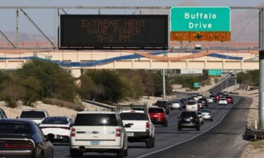 A digital road sign on Summerlin Parkway displays a message asking motorists to save power due to extreme heat conditions on September 7 in Las Vegas.