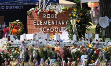 Two officers with the Texas Department of Public Safety who were at the scene of the Uvalde school massacre have been suspended with pay during an investigation. A memorial for the victims of the mass shooting at Robb Elementary School is seen here on May 27.