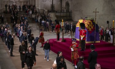 Members of the public view the coffin of Queen Elizabeth II as it lies in state in London's Westminster Hall on Thursday