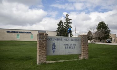 Police patrol outside Columbine High School in 2019