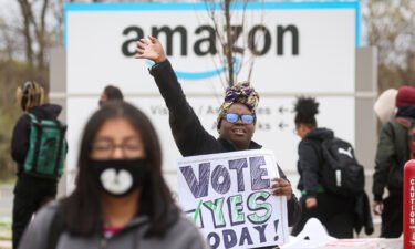 Amazon has lost the first round in its effort to overturn a historic union victory at a Staten Island facility. An Amazon Labor Union organizer greets workers outside an Amazon sortation center in Staten Island on April 25.