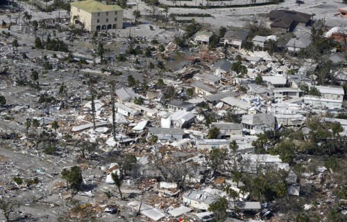 Damaged homes and debris are shown in the aftermath of Hurricane Ian on September 29 in Fort Myers