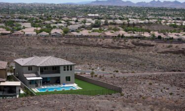 A home with a swimming pool abuts the desert on the edge of the Las Vegas Valley.