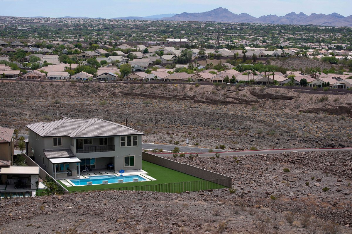 <i>John Locher/AP</i><br/>A home with a swimming pool abuts the desert on the edge of the Las Vegas Valley.