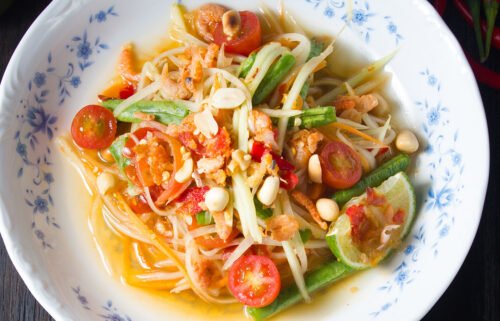 The world's best spicy foods includes a green papaya salad with a fiery kick.