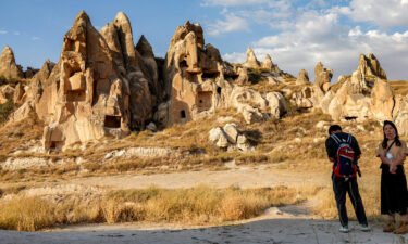 Tourists visit the cave dwellings at Goreme Historical National Park in central Turkey's historical Cappadocia (Kapadokya) region on August 23.