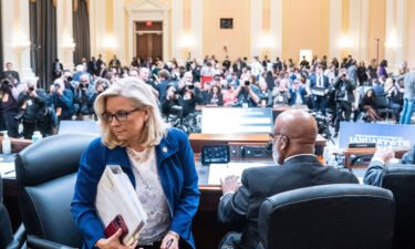 Committee Vice Chair Liz Cheney leaves during a break in the hearing to investigate the January 6 attack on the US Capitol on October 13.  Cheney says the January 6 committee will issue former president Donald Trump a subpoena 'shortly.'