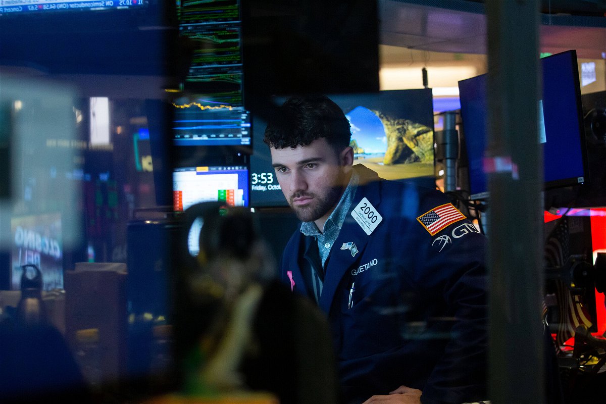 <i>Chine Nouvelle/SIPA/Shutterstock</i><br/>Stocks continue to sizzle in October. A trader here works on the floor of the New York Stock Exchange on October 7.