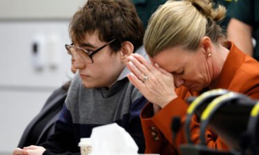 Assistant Public Defender Melisa McNeill (right) touched her hands to her head while sitting next to Nikolas Cruz as the verdicts were read in court on October 13.