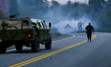 Police fire tear gas a they work to evict Mapuche Indigenous people from land they have been occupying for years near Villa Mascardi