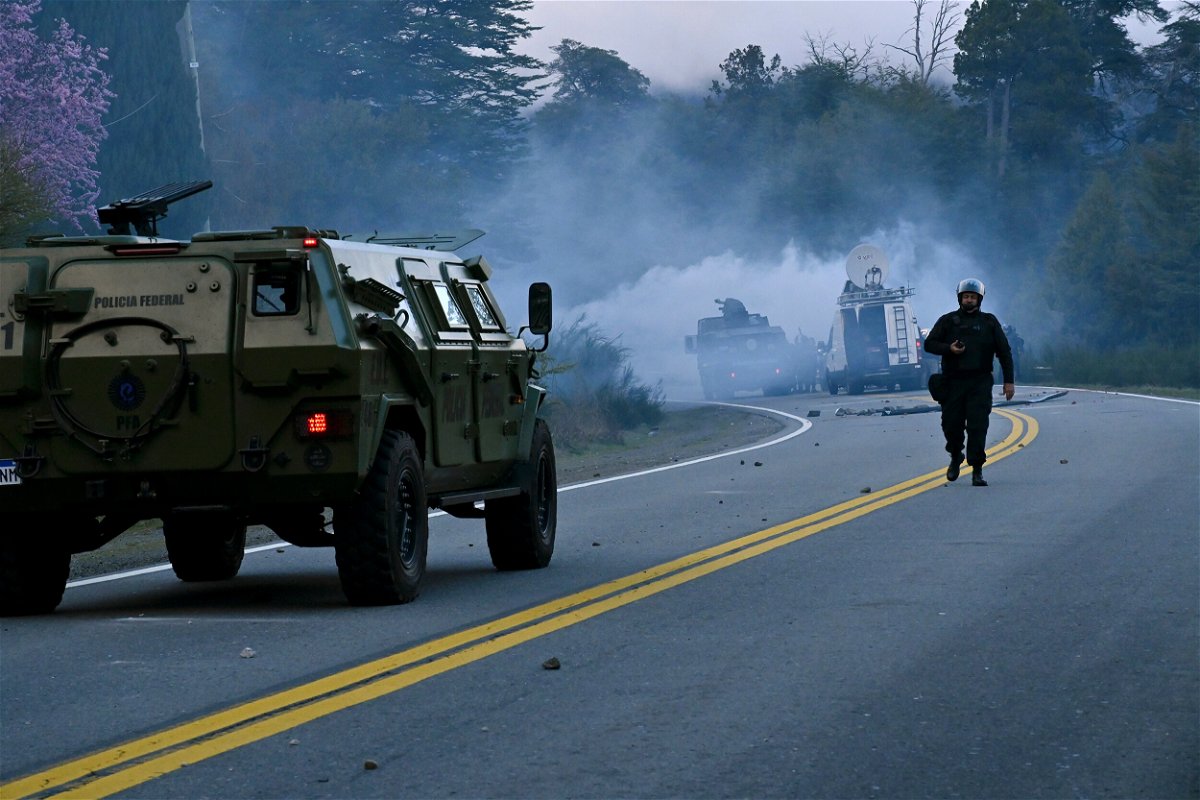 <i>Alfredo Leiva/AP</i><br/>Police fire tear gas a they work to evict Mapuche Indigenous people from land they have been occupying for years near Villa Mascardi
