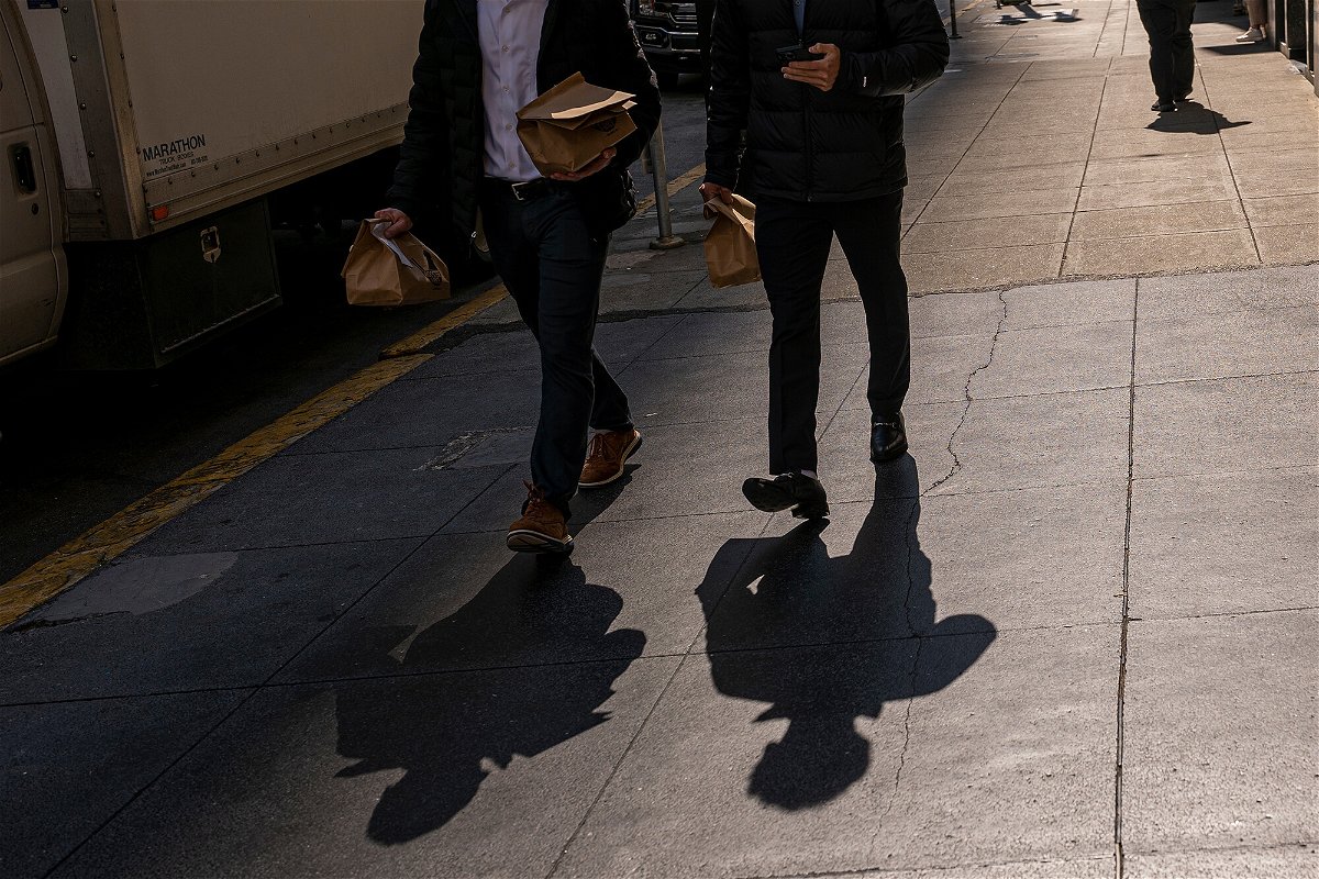 <i>David Paul Morris/Bloomberg/Getty Images</i><br/>Wages and salaries for civilian workers increased by 1.3% in the third quarter and 5.1% over the year ending in September. Pedestrians are pictured here in San Francisco on October 10.