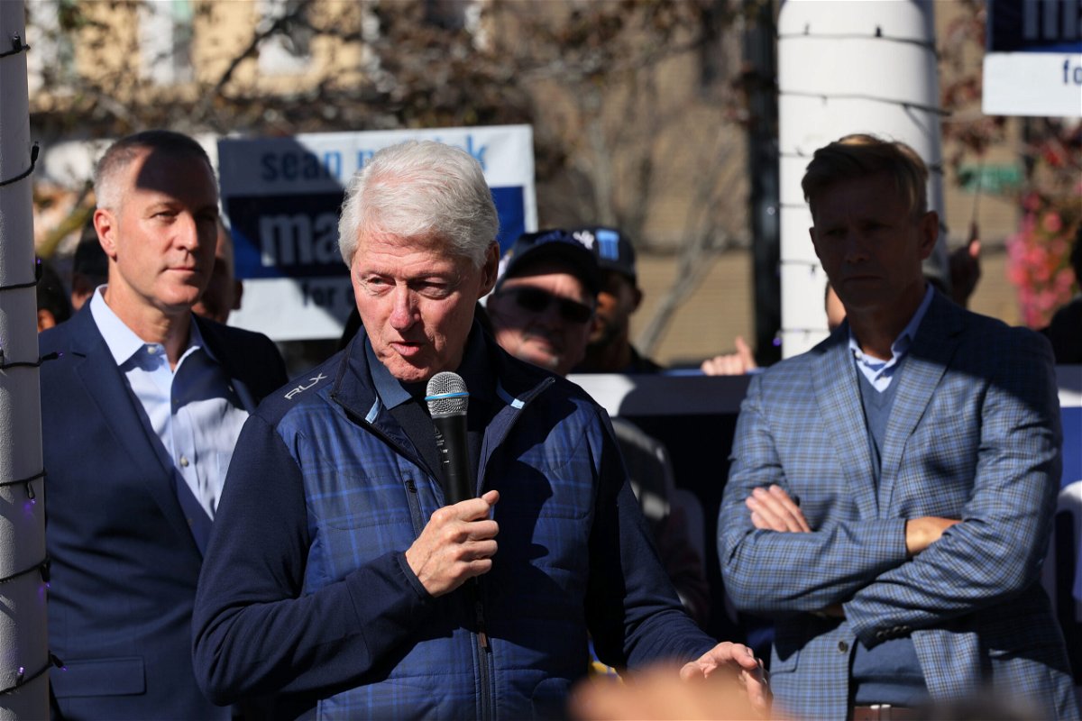 <i>Michael M. Santiago/Getty Images</i><br/>Former president Bill Clinton speaks during a rally at Nyack Veteran's Memorial Park on October 29 in Nyack
