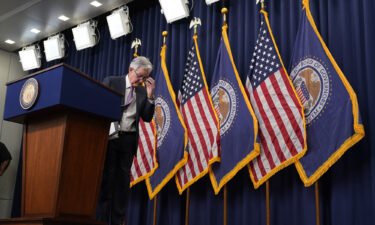 Federal Reserve Chair Jerome Powell departs after speaking at a news conference on September 21