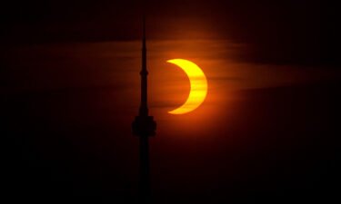 A partial solar eclipse is seen from Toronto
