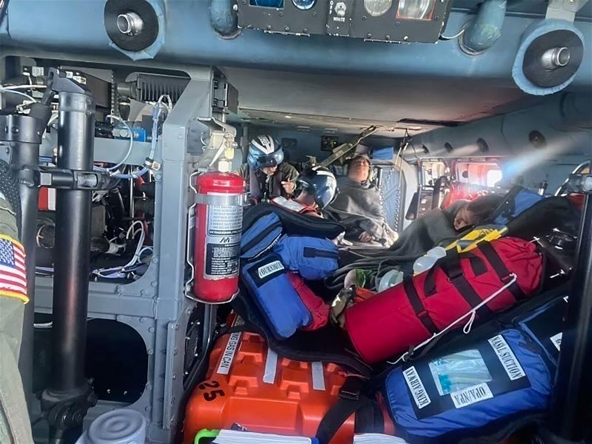 <i>Coast Guard Air Station New Orleans</i><br/>A Coast Guard Jayhawk aircrew treats the rescued boaters for injuries.