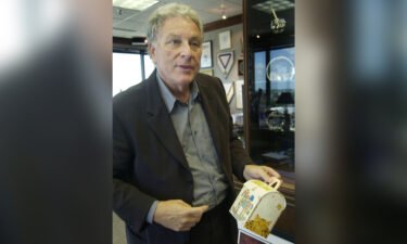 Bob Bernstein holds an original Happy Meal box at his office in 2004. Bernstein invented the Happy Meal.