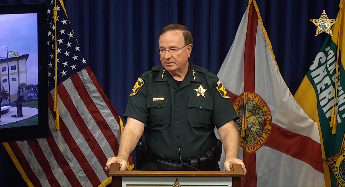 <i>Polk County Sheriff's Office</i><br/>Polk County Sheriff Grady Judd speaks during a news conference about a father and son arrested for attempted murder after allegedly opening fire on a woman sitting in her car.