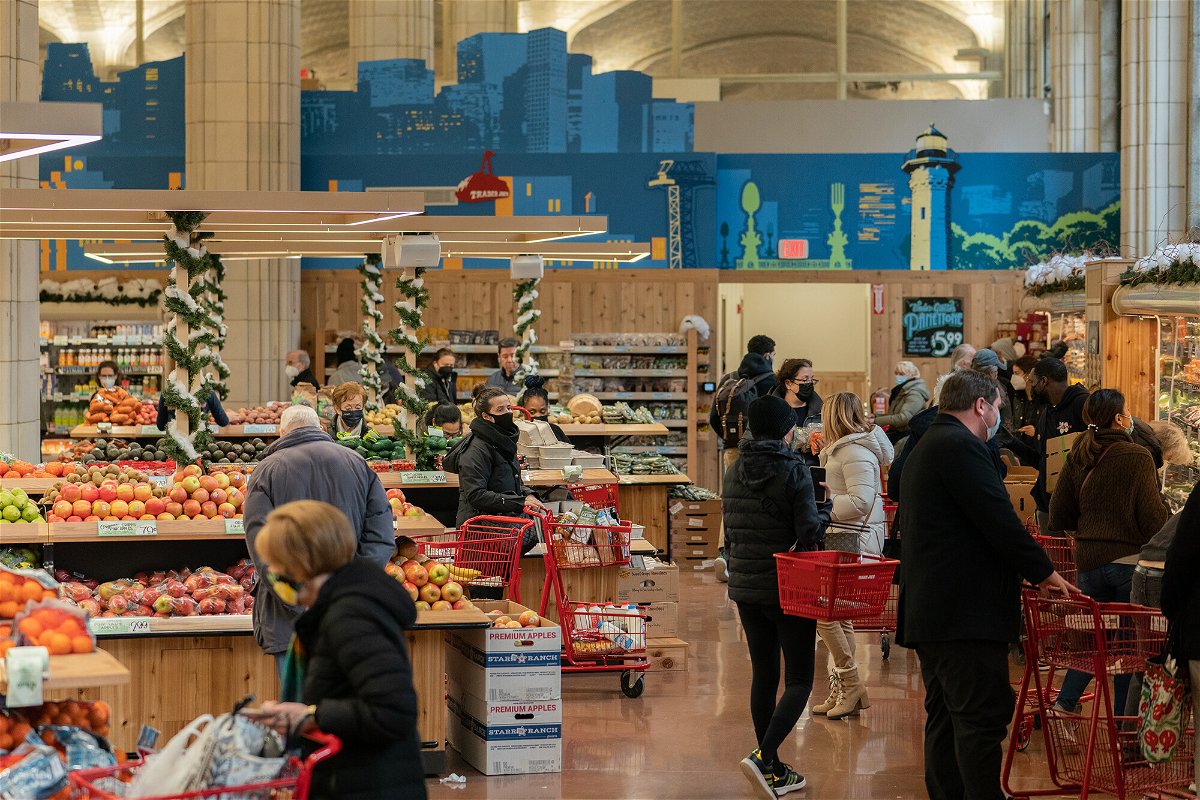 <i>Jeenah Moon/Bloomberg/Getty Images</i><br/>Customers shop at the Trader Joe's Upper East Side Bridgemarket grocery store in New York