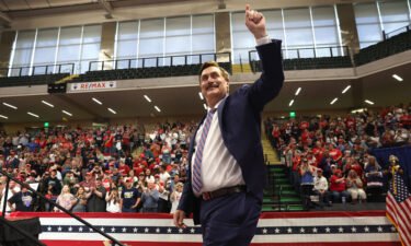 MyPillow CEO Mike Lindell greets the crowd during a "Save America" rally at the Alaska Airlines Center on July 9 in Anchorage